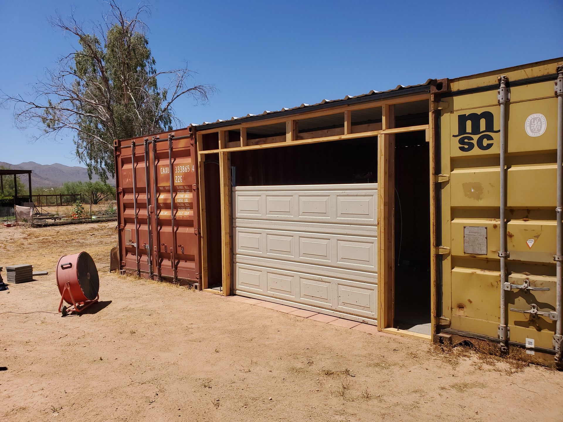 garage door installation after being framed between two container