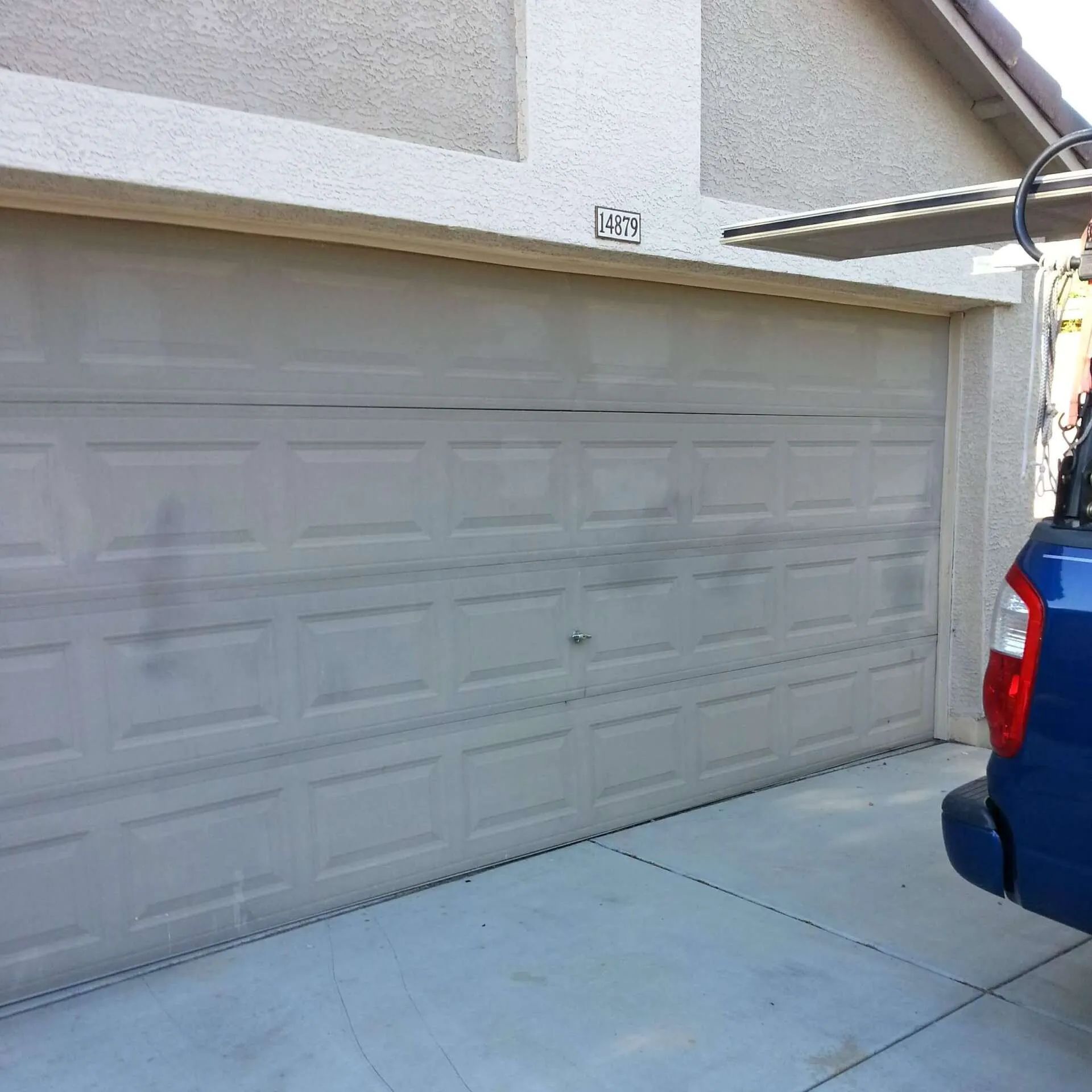 An old garage door that needs to be replaced