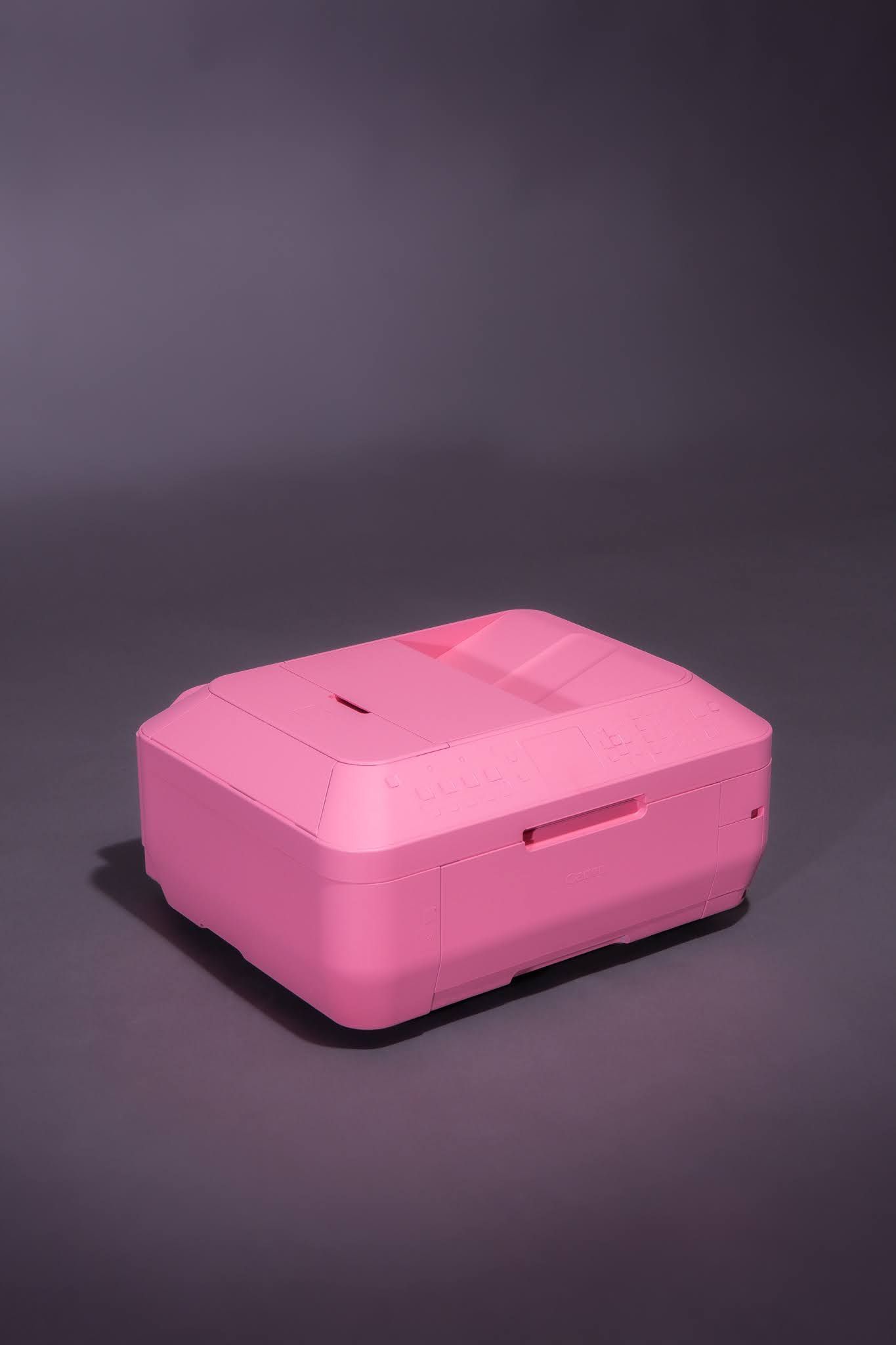 Pink rectangular device on a gray surface; art by Matt Remsbecher. 