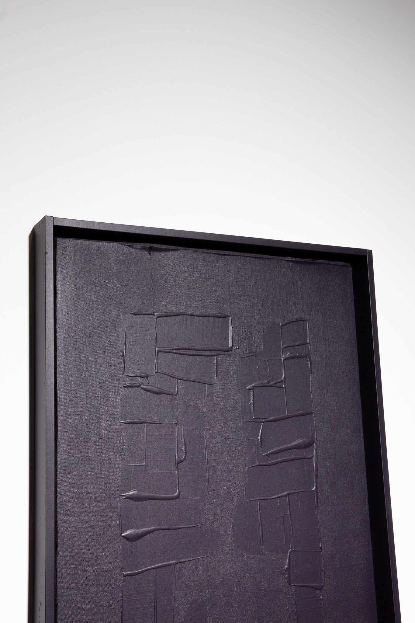 Black rectangular textured artwork with a dark border against a white background; art by Matt Remsbecher. 