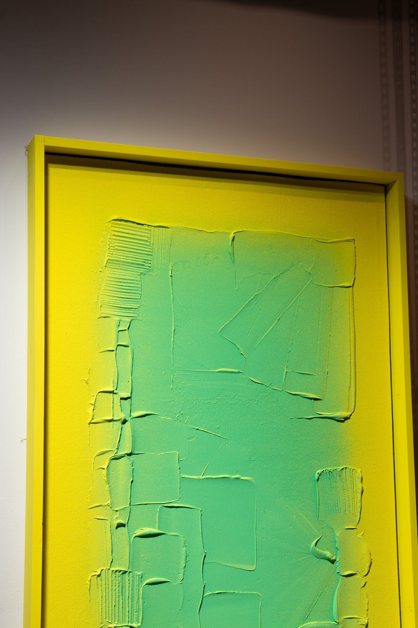 Yellow framed art with a gradient green and yellow abstract design; art by Matt Remsbecher. 