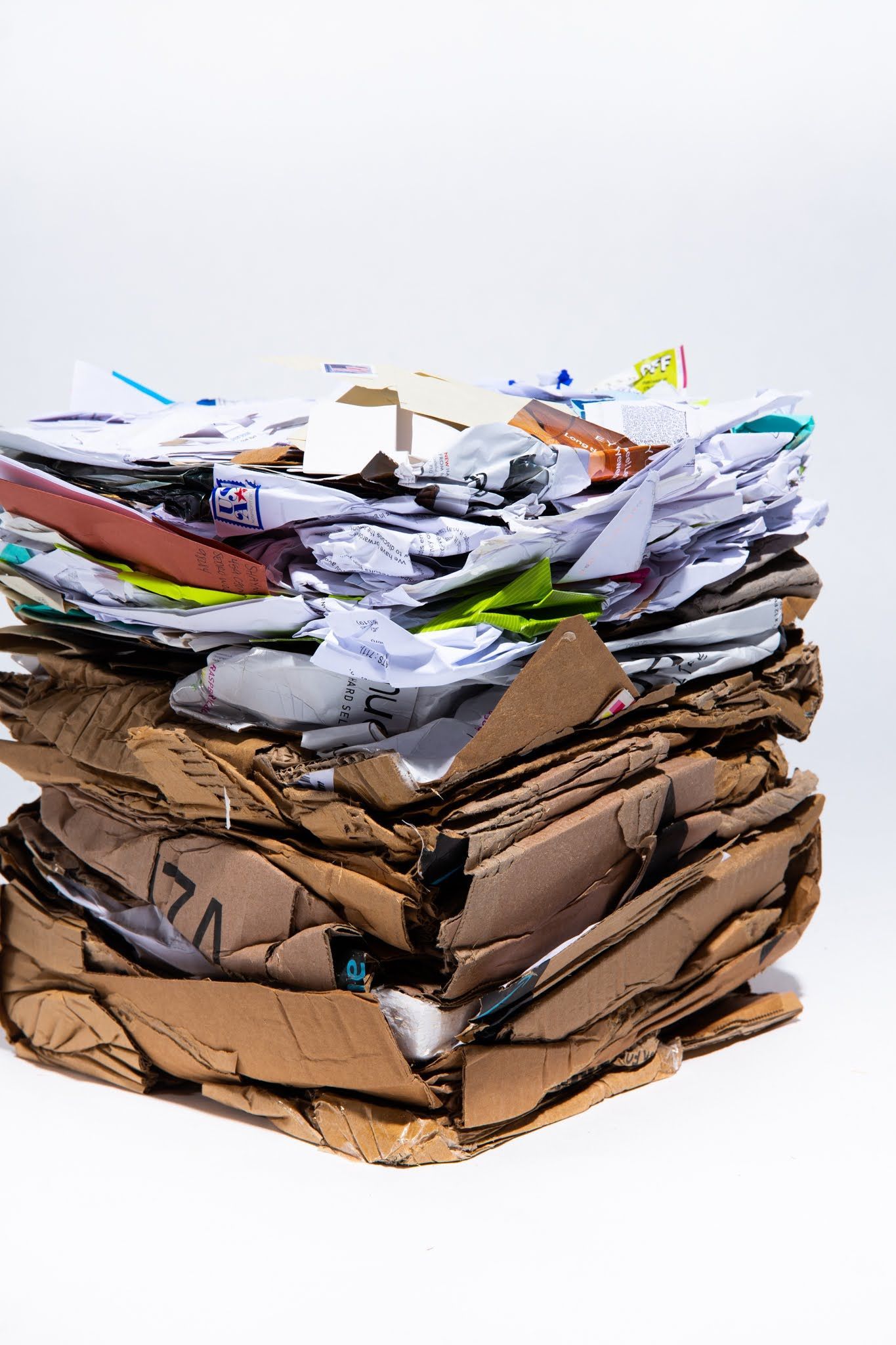 Pile of cardboard and paper waste ready for recycling; art by Matt Remsbecher. 