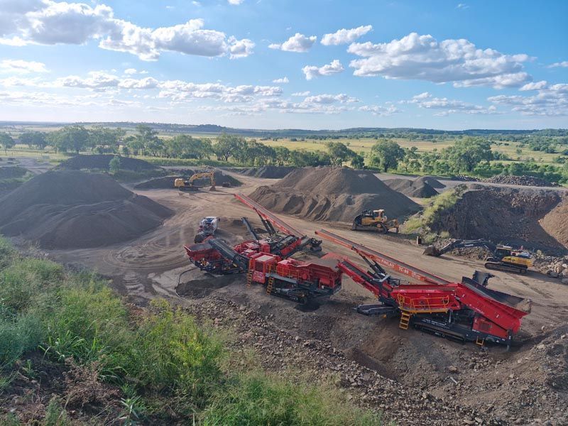 An aerial view of a construction site with a lot of machinery.