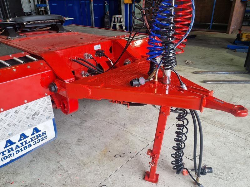 A red trailer with the word aaa on the back