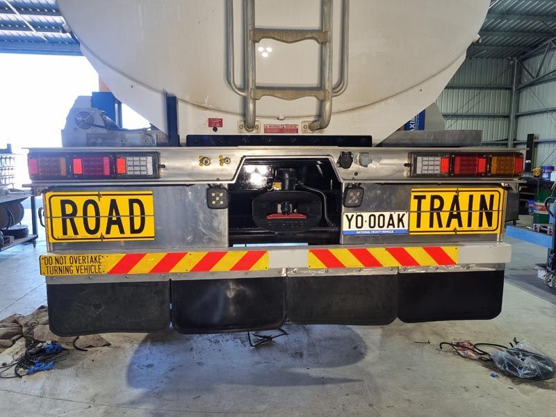 A truck with a license plate that says road train