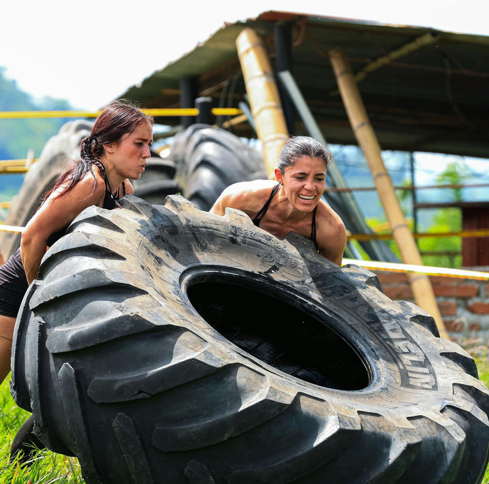 women moving tire