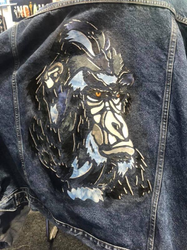 A denim jacket with a picture of a gorilla on it