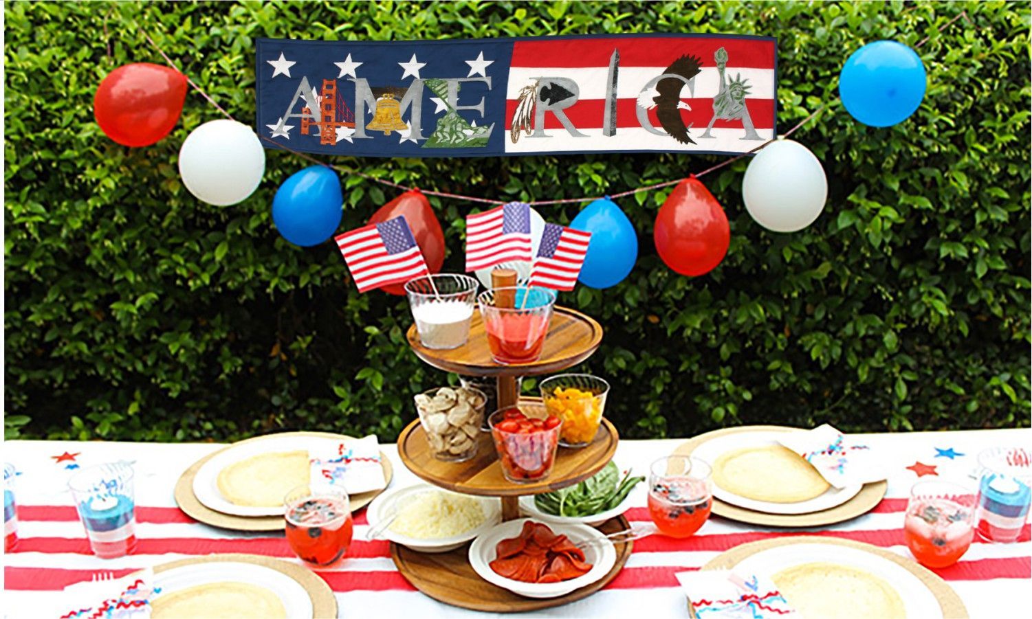 A table with plates and a sign that says america