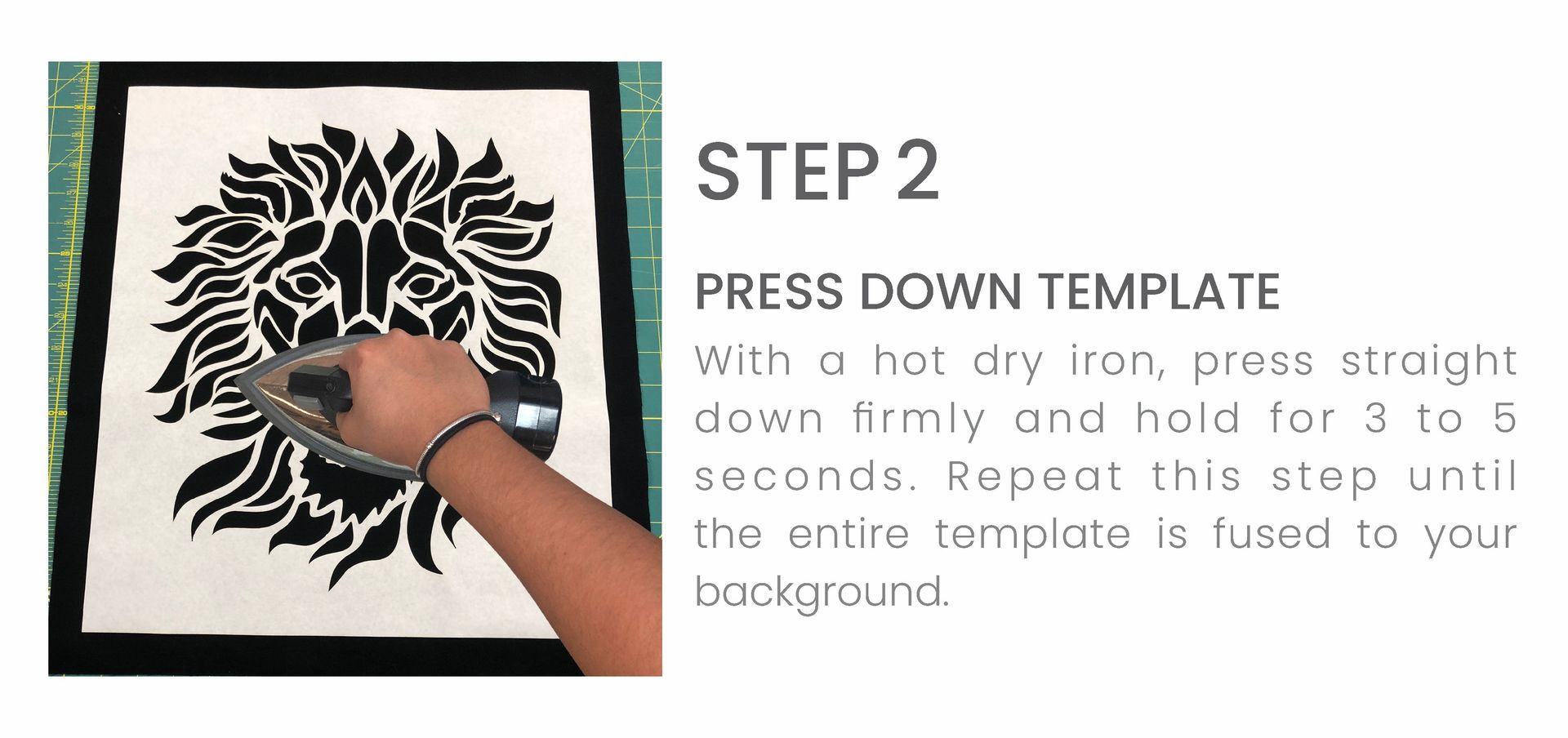 A person is using a hat dry iron to press down a template.