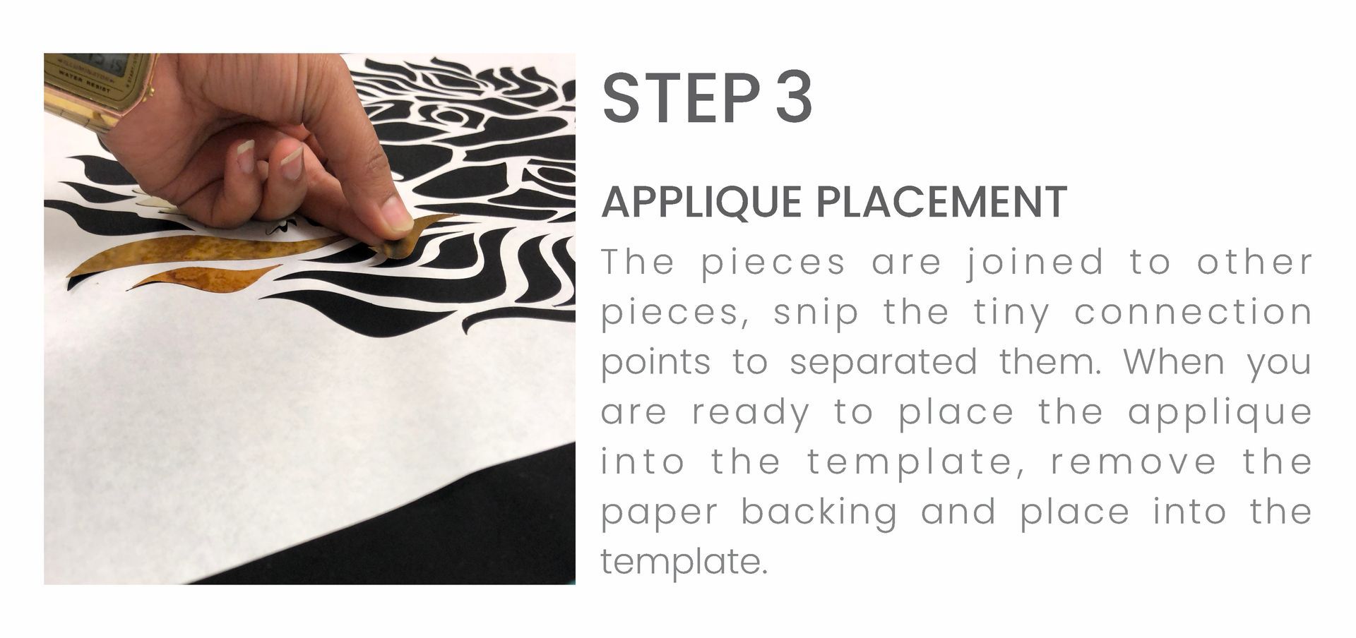 A person is applying a sticker to a piece of paper.