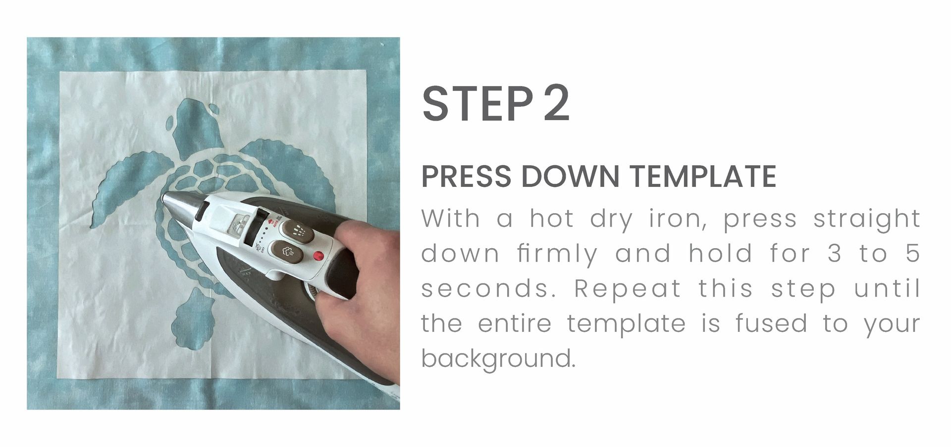 A person is ironing a picture of a sea turtle on a piece of fabric.