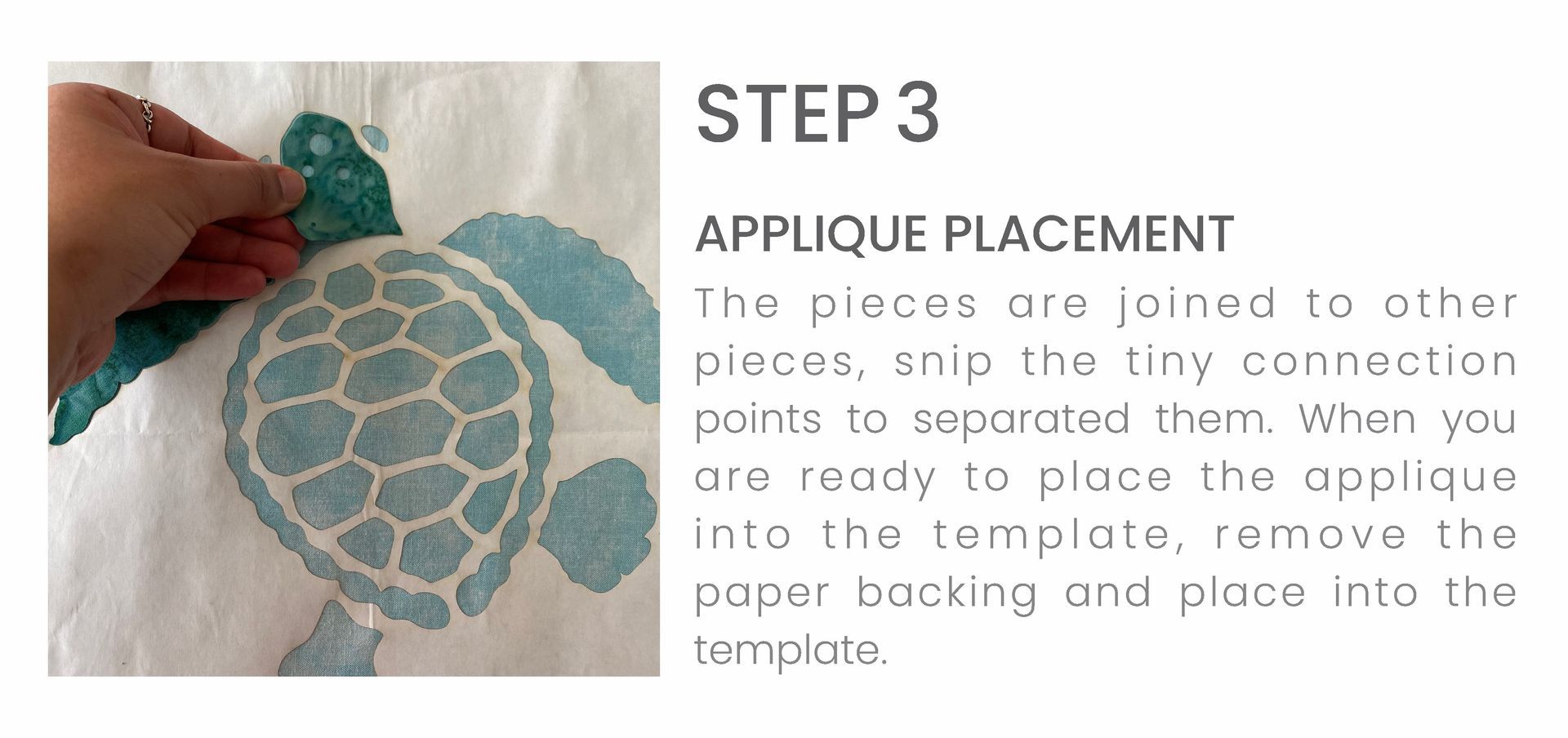 A person is applying a turtle stencil to a piece of fabric.