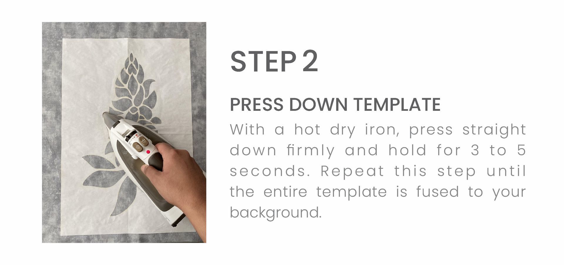 A person is ironing a piece of fabric with a hat dry iron.