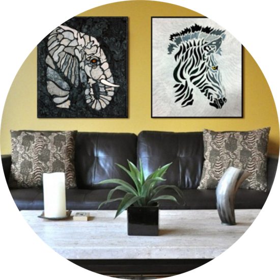 A living room with an elephant and zebra paintings on the wall