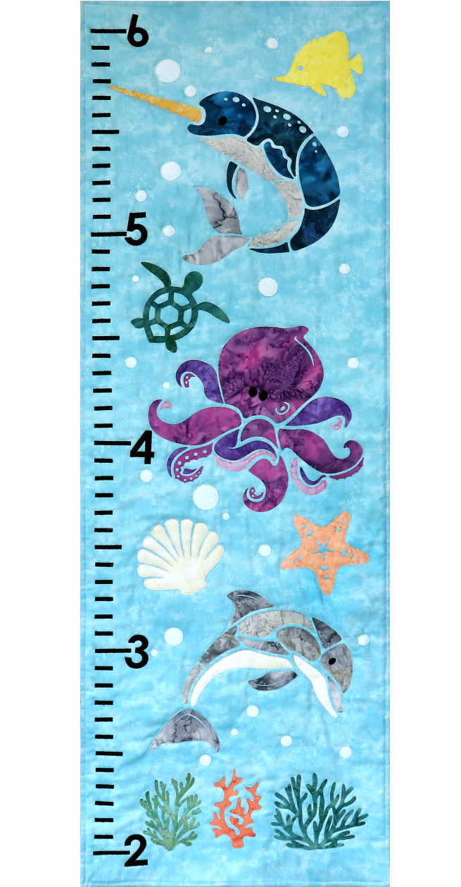 A blue growth chart with sea creatures on it