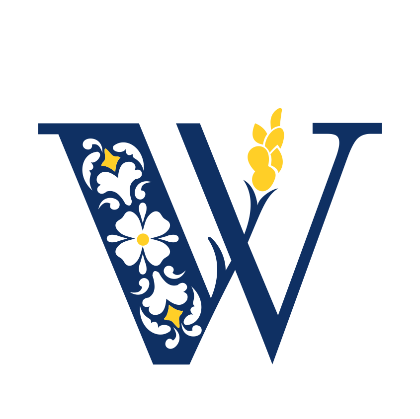 The letter w is decorated with flowers and wheat.