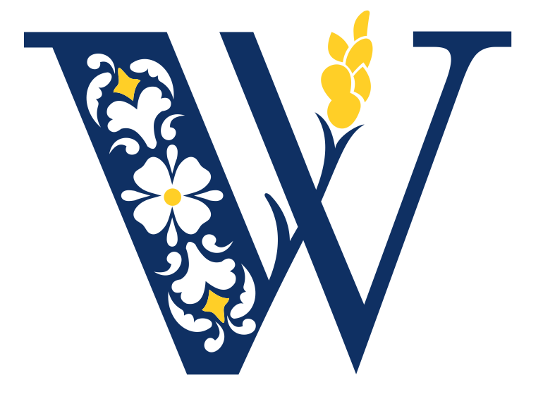 The letter w is decorated with flowers and wheat