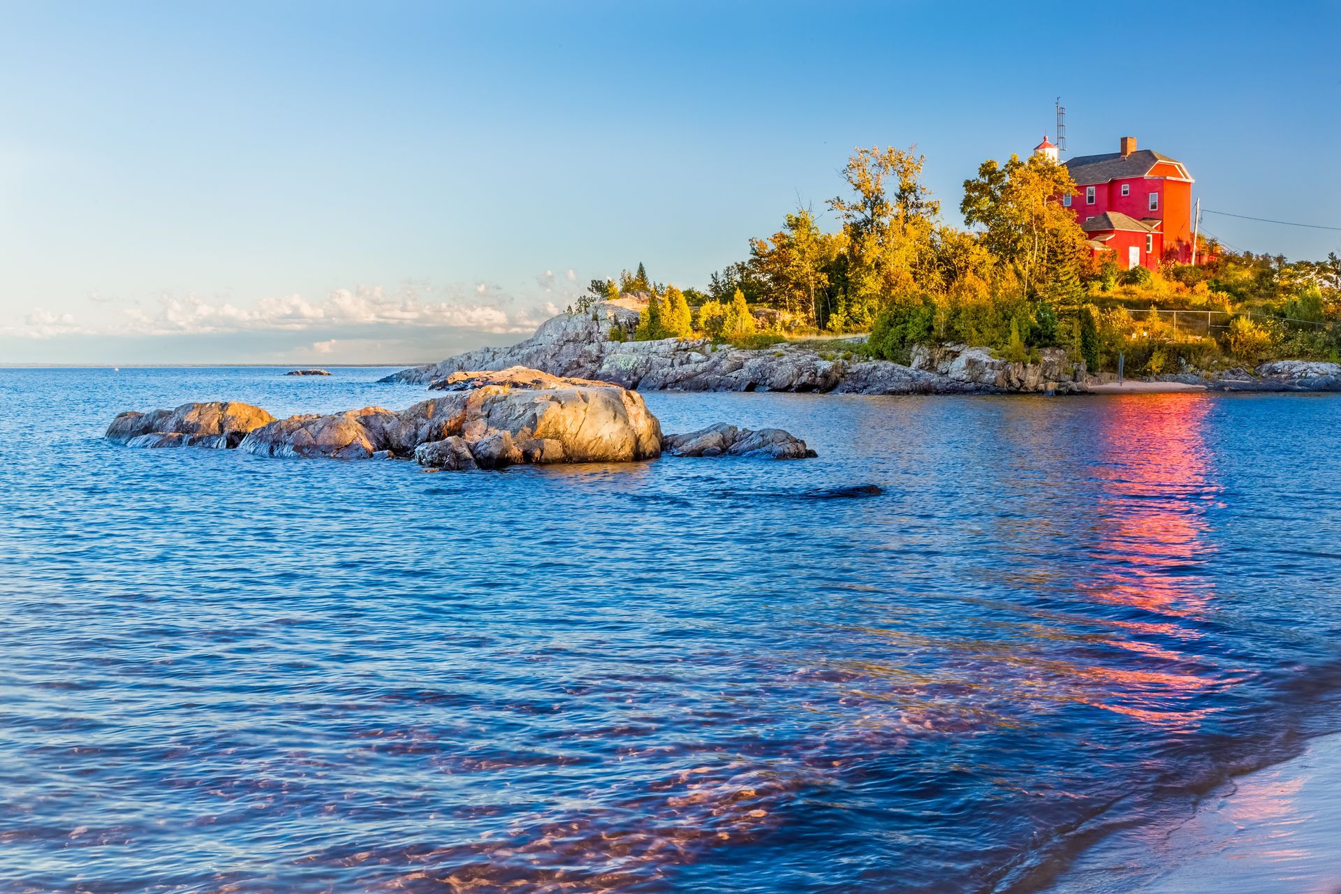 A large body of water with a small island in the middle of it.