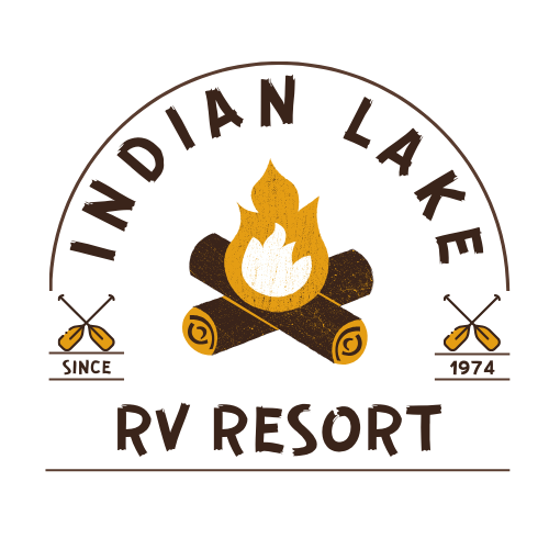 the logo for indian lake rv resort shows a campfire and two oars .