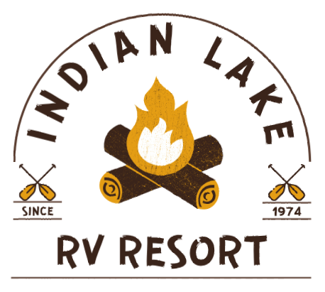a logo for indian lake rv resort with a campfire and oars