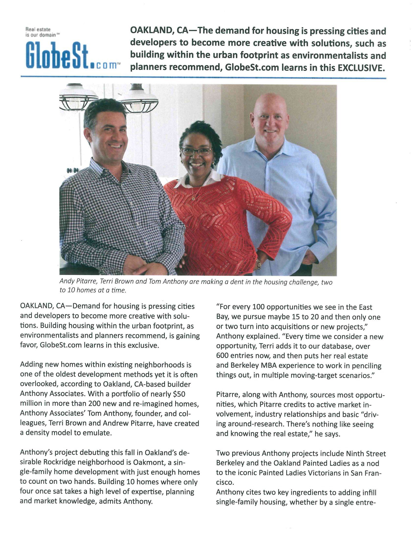 A couple of men and a woman are standing next to each other.