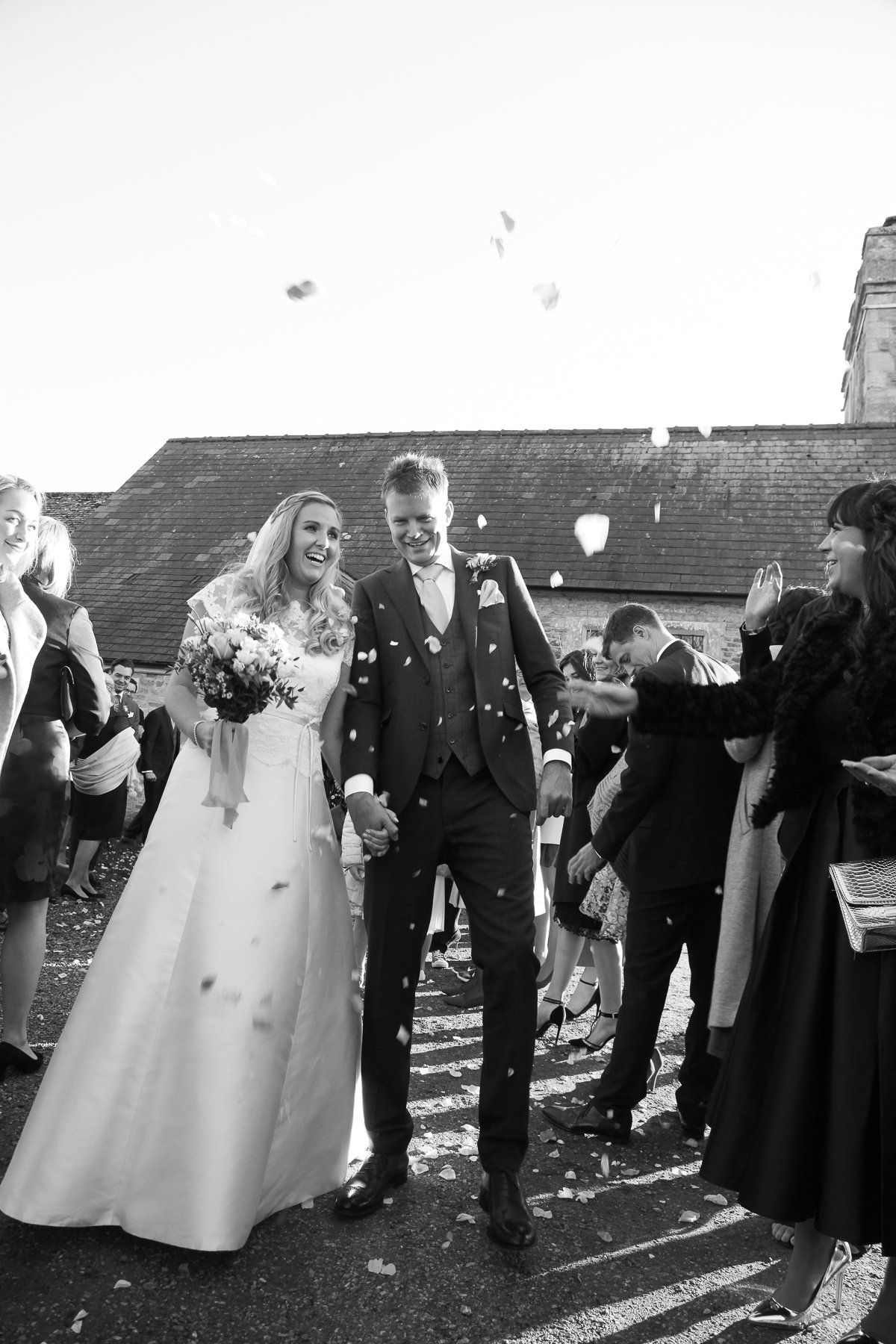 bride and groom confetti photo in black and white
