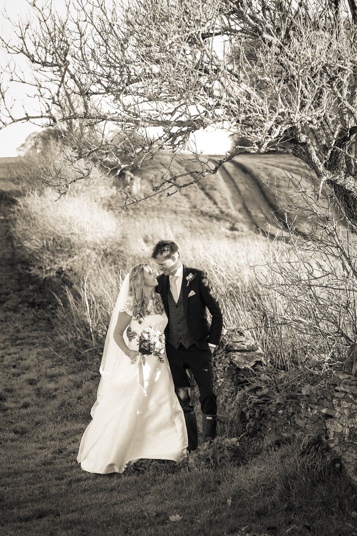 bride and groom at stone barn photography
