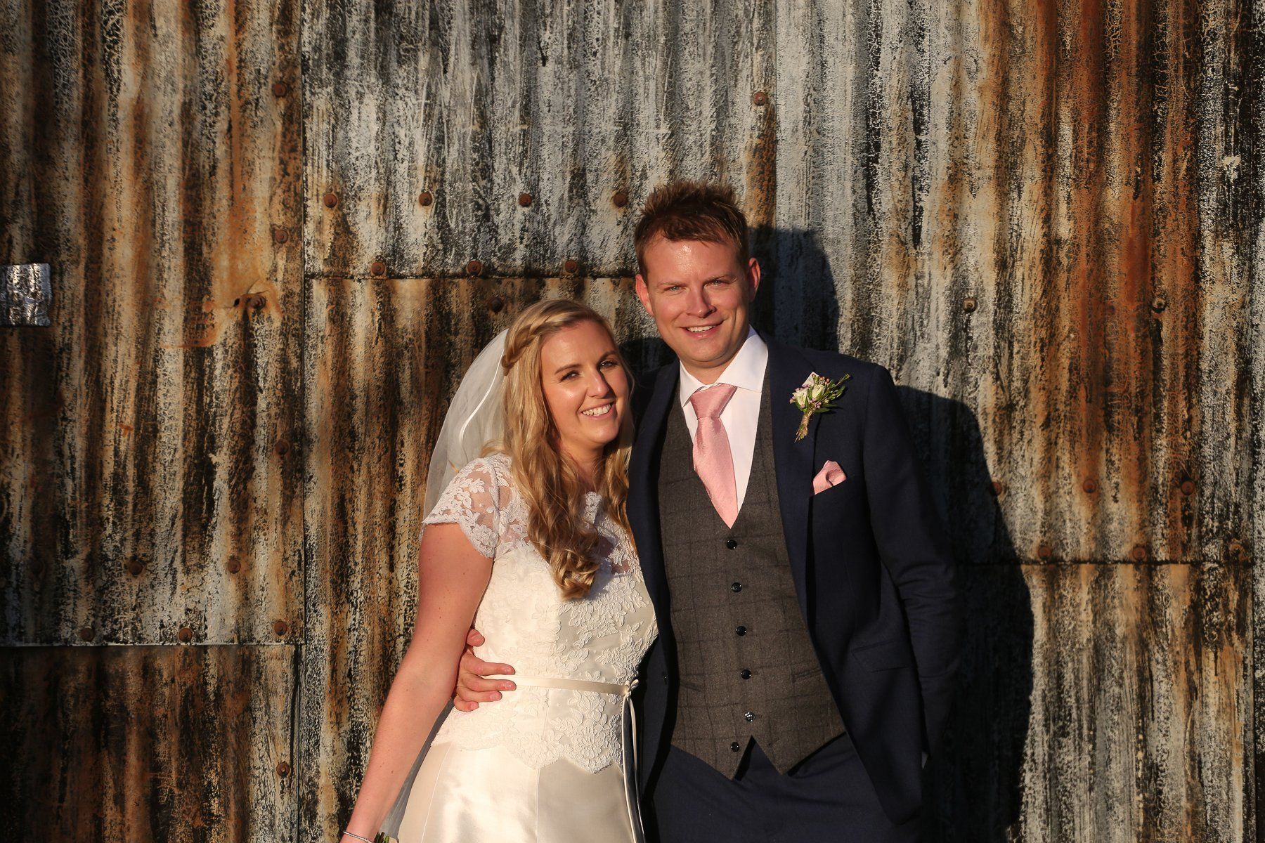 stone barn bride and groom