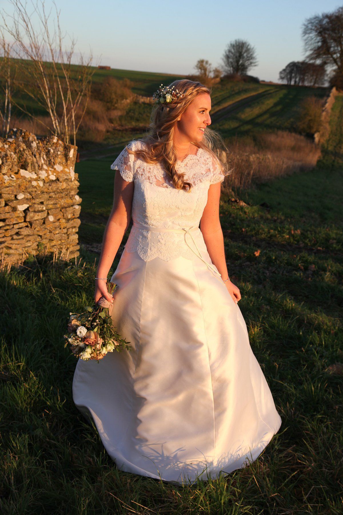 bride at cripps stone barn sunset