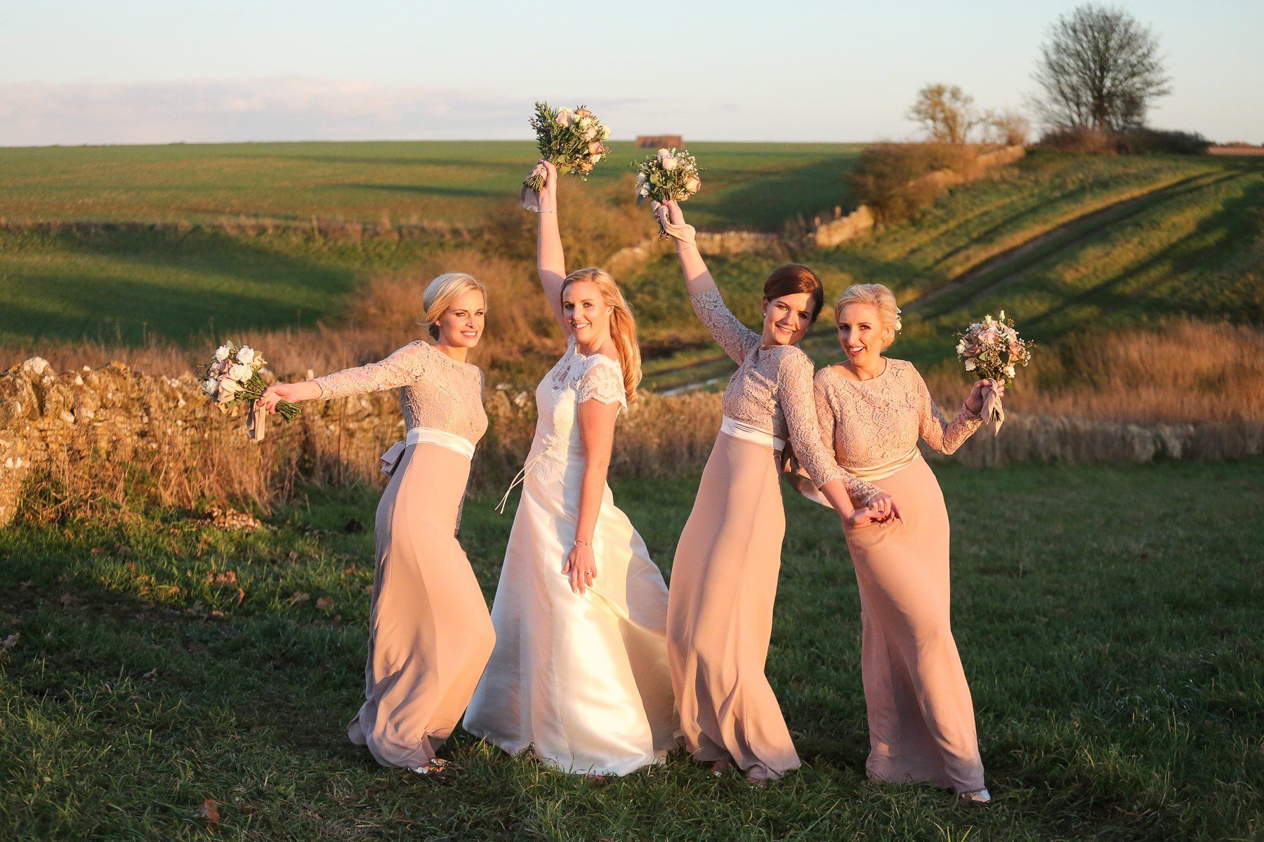 cripps stone barn bride and bridesmaids at sunset