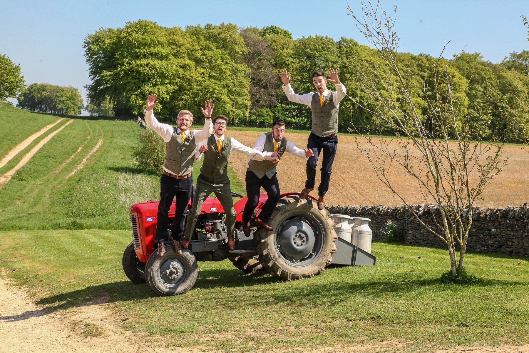 tractor at stone barn wedding