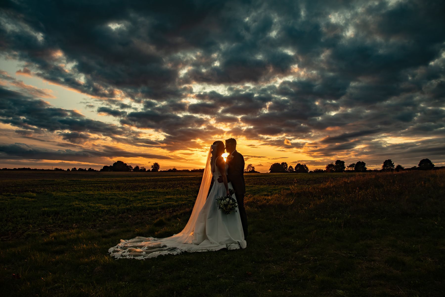 Lara and Tom's October wedding photography at Painswick Church and Stone Barn in The Cotswolds