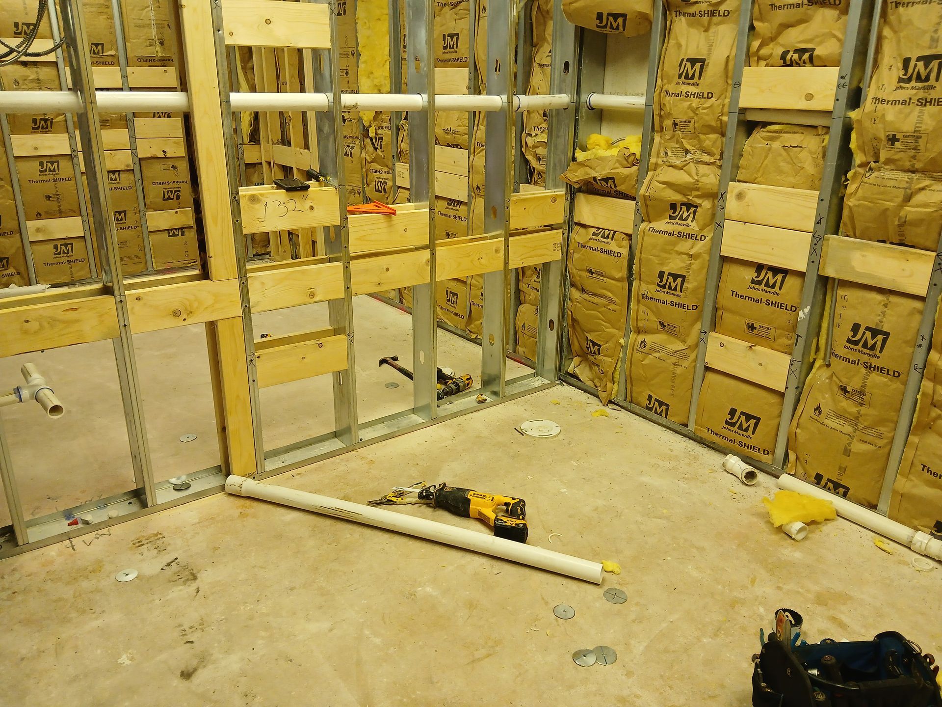 A room that is being built with a lot of boxes on the wall