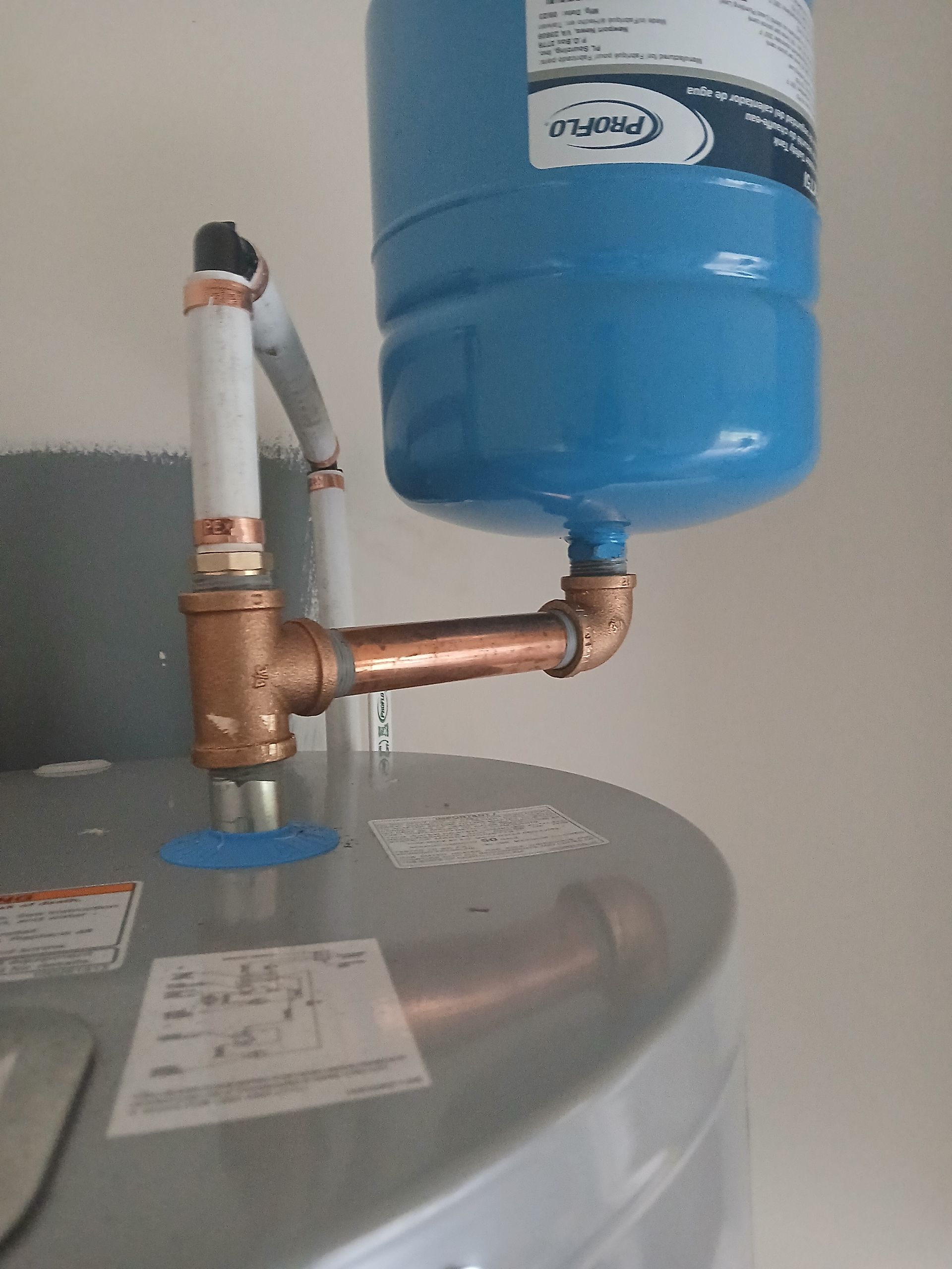 A water heater with a blue tank attached to it