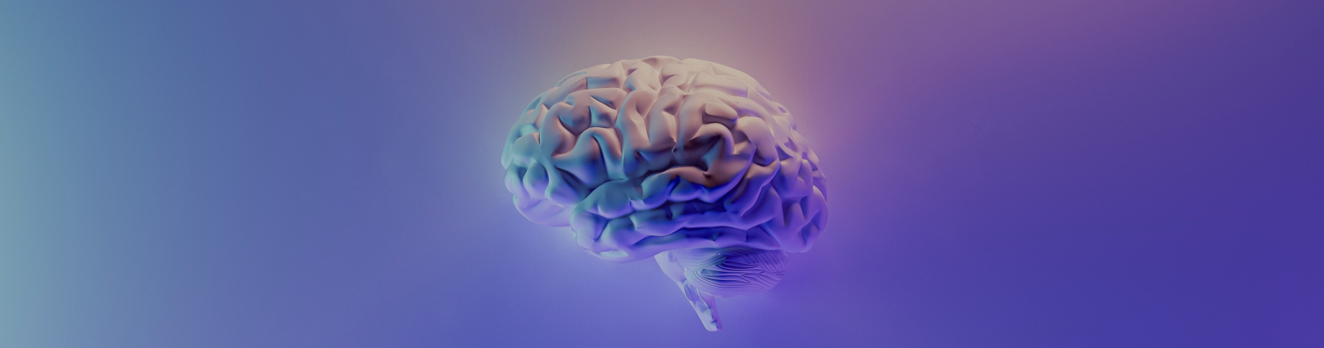 A photo of a brain in blue, purple, and golden light colors