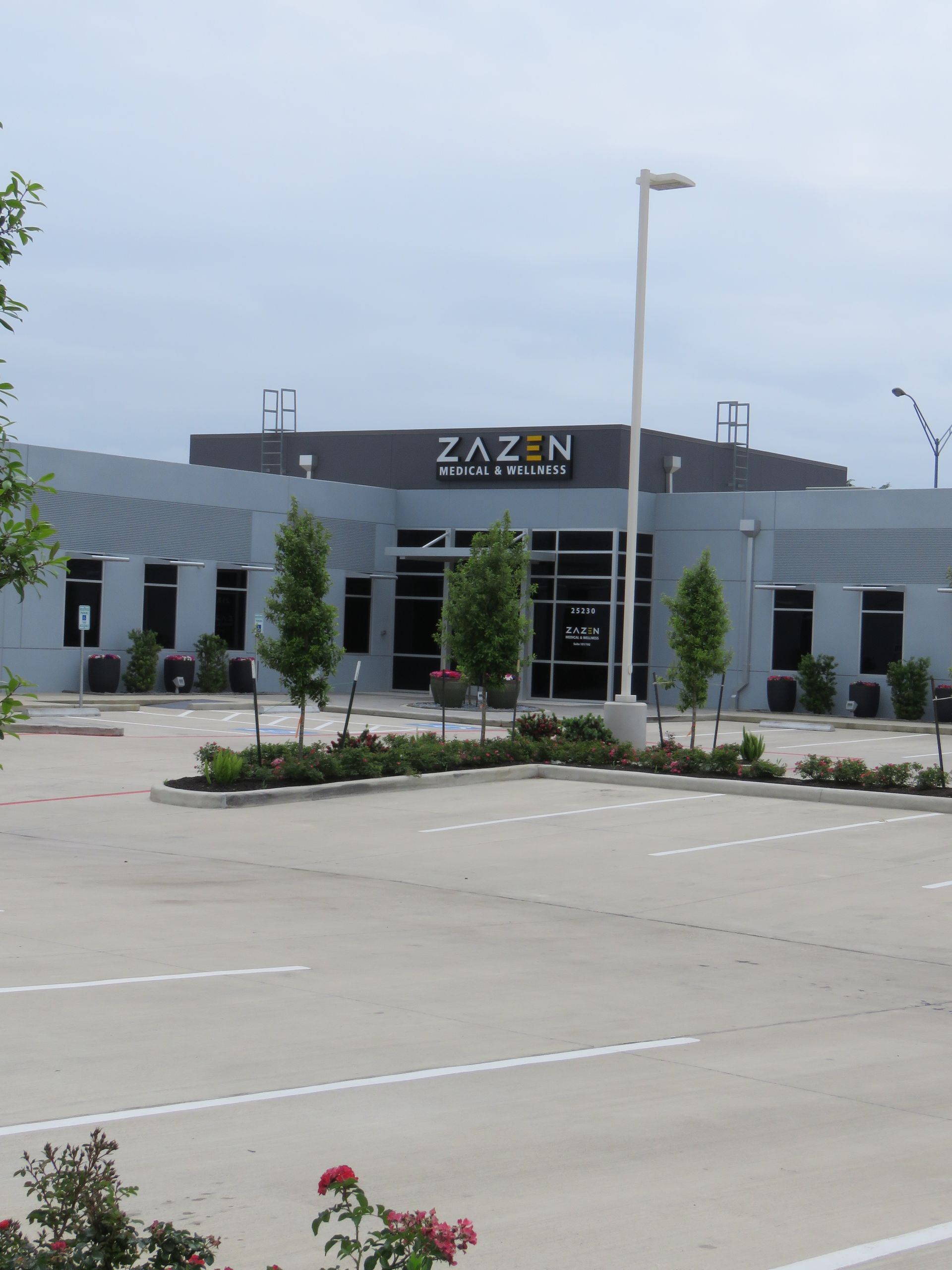 photo of the Zazen Surgery Center full building from a distance with their logo on top of the building.