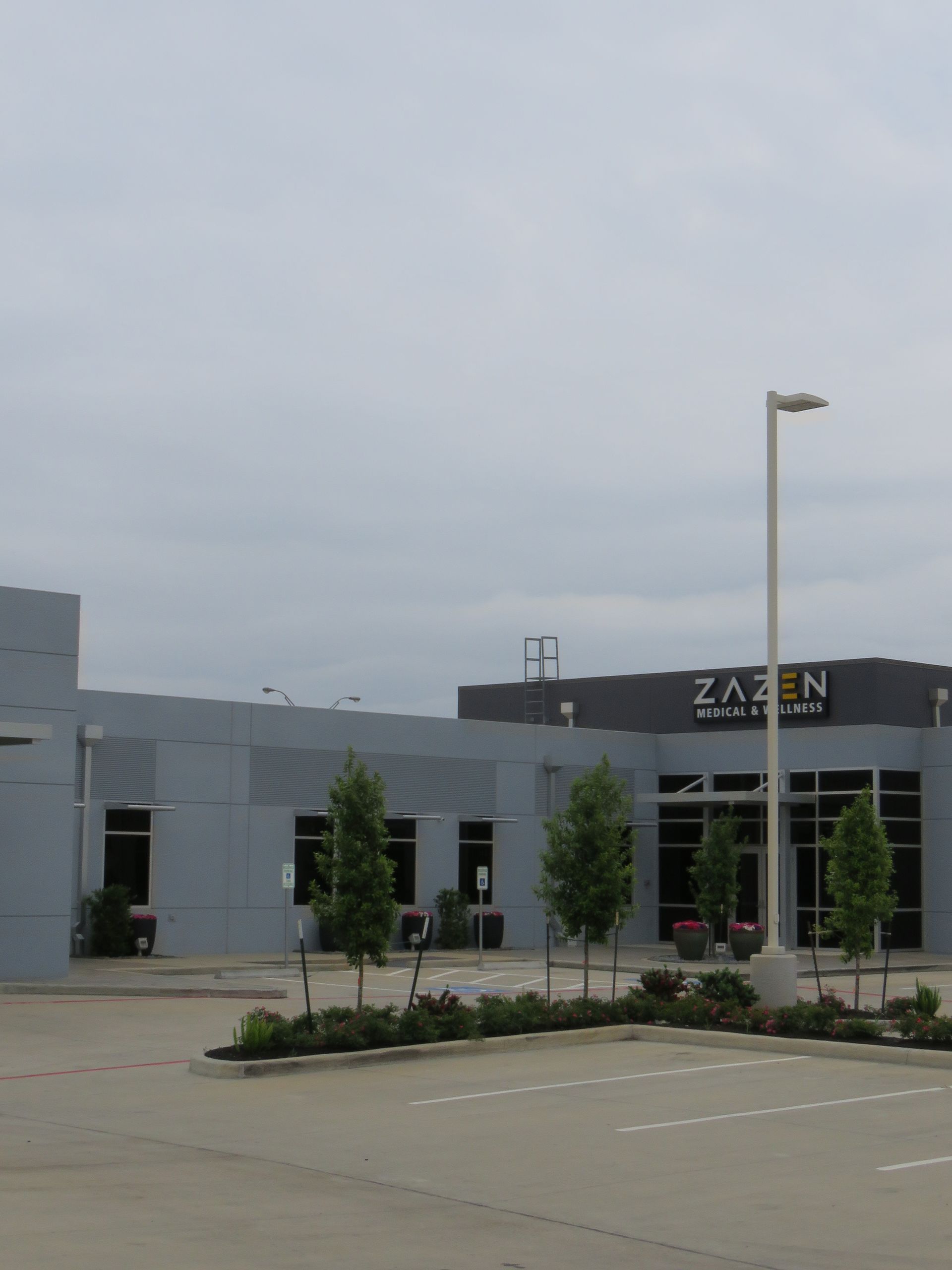 photo of the Zazen Surgery Center full building from a distance with their logo on top of the building.