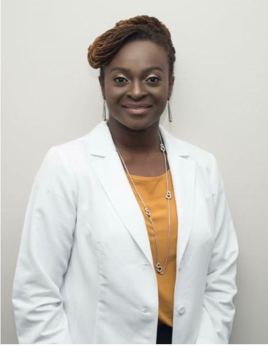 Dr. Vivian Asamoah of Zazen surgery center in a white doctor's coat