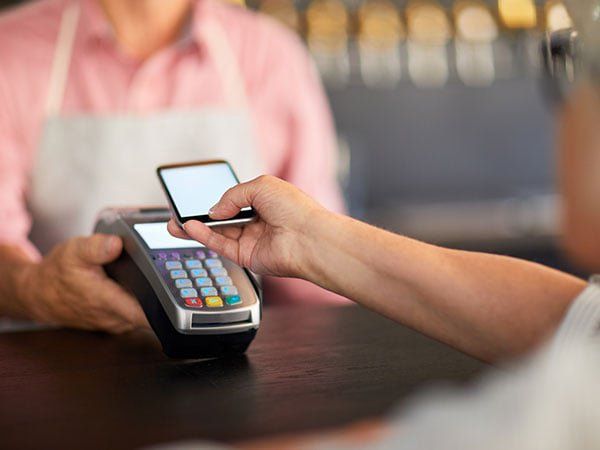Making Online Payment In Cafe — Wilmington, NC — GSO Enterprises LLC