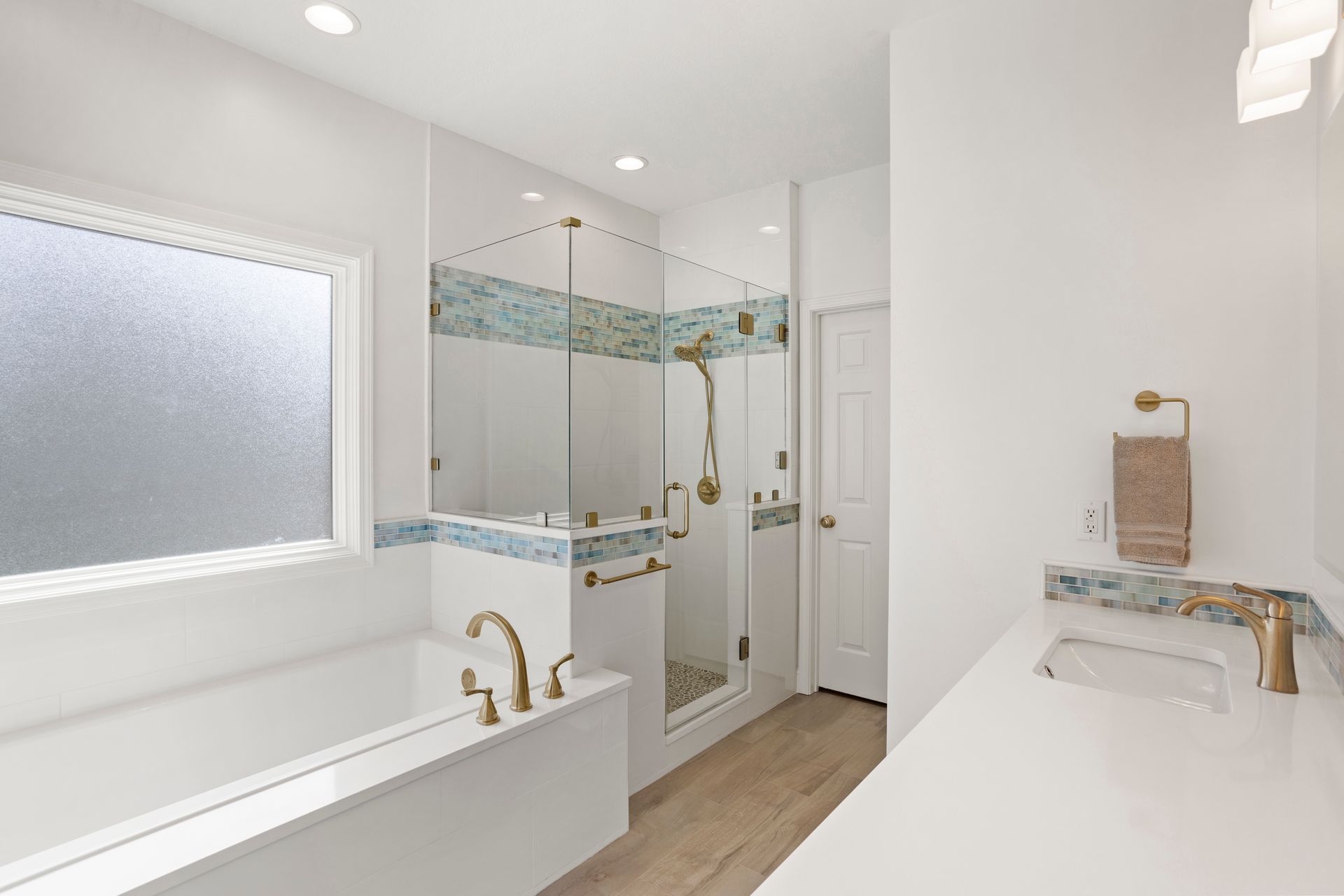 Bright white bathroom remodeled by Nunley Custom Homes in Greenville, SC.