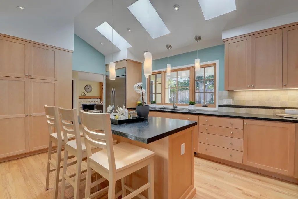 Modern kitchen with light wood cabinets, built by Nunley Custom Homes in Greenville, SC.