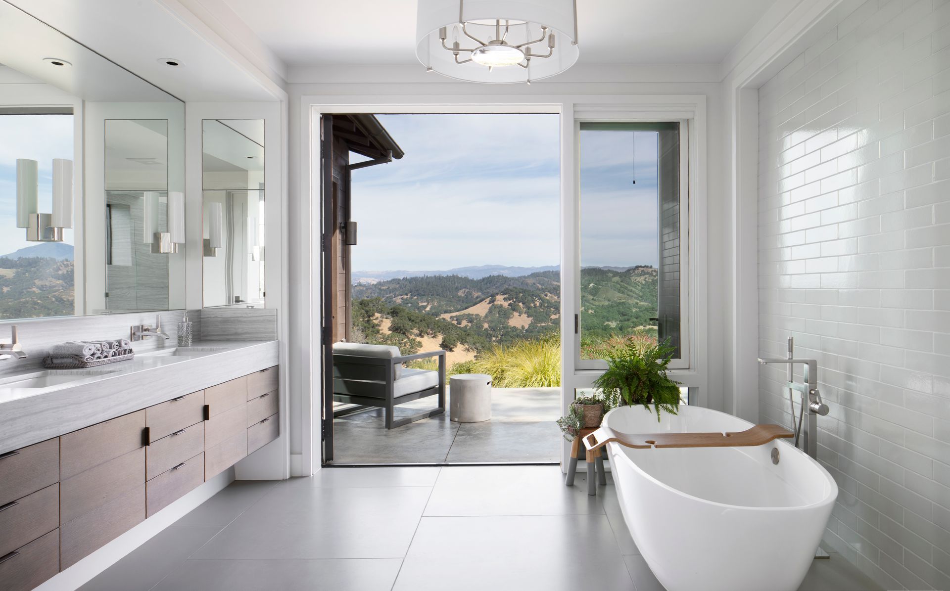 Bright bathroom with sliding doors remodeled by Nunley Custom Homes in Greenville, SC.
