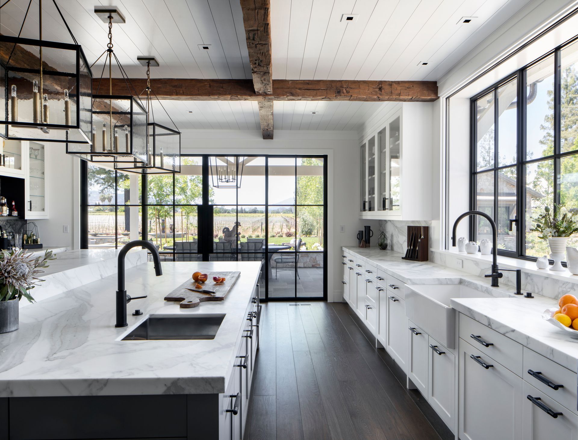 Modern kitchen with white marble countertops remodeled by Nunley Custom Homes in Greenville, SC.