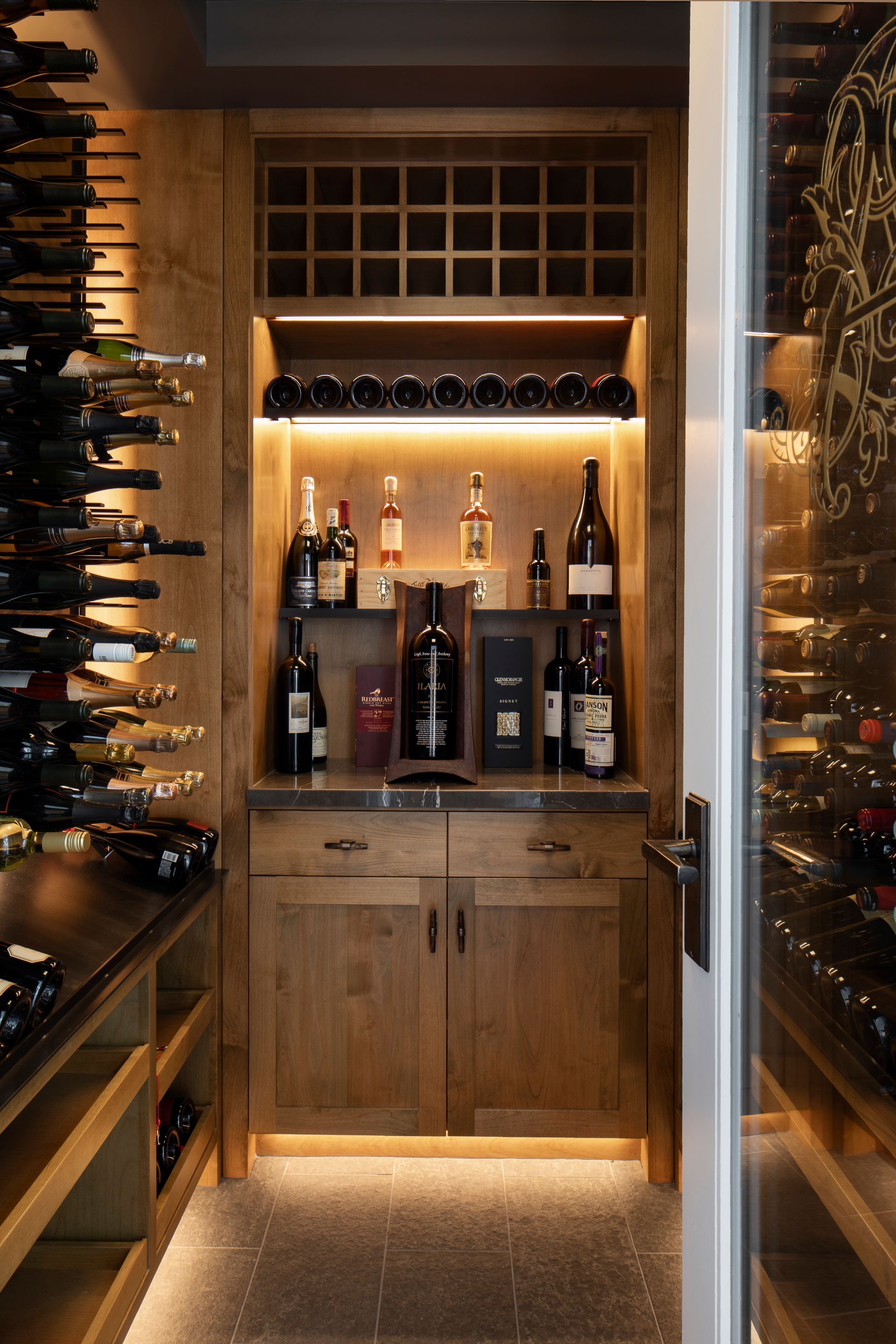 Wine cellar with wooden shelves remodeled by Nunley Custom Homes in Greenville, SC.