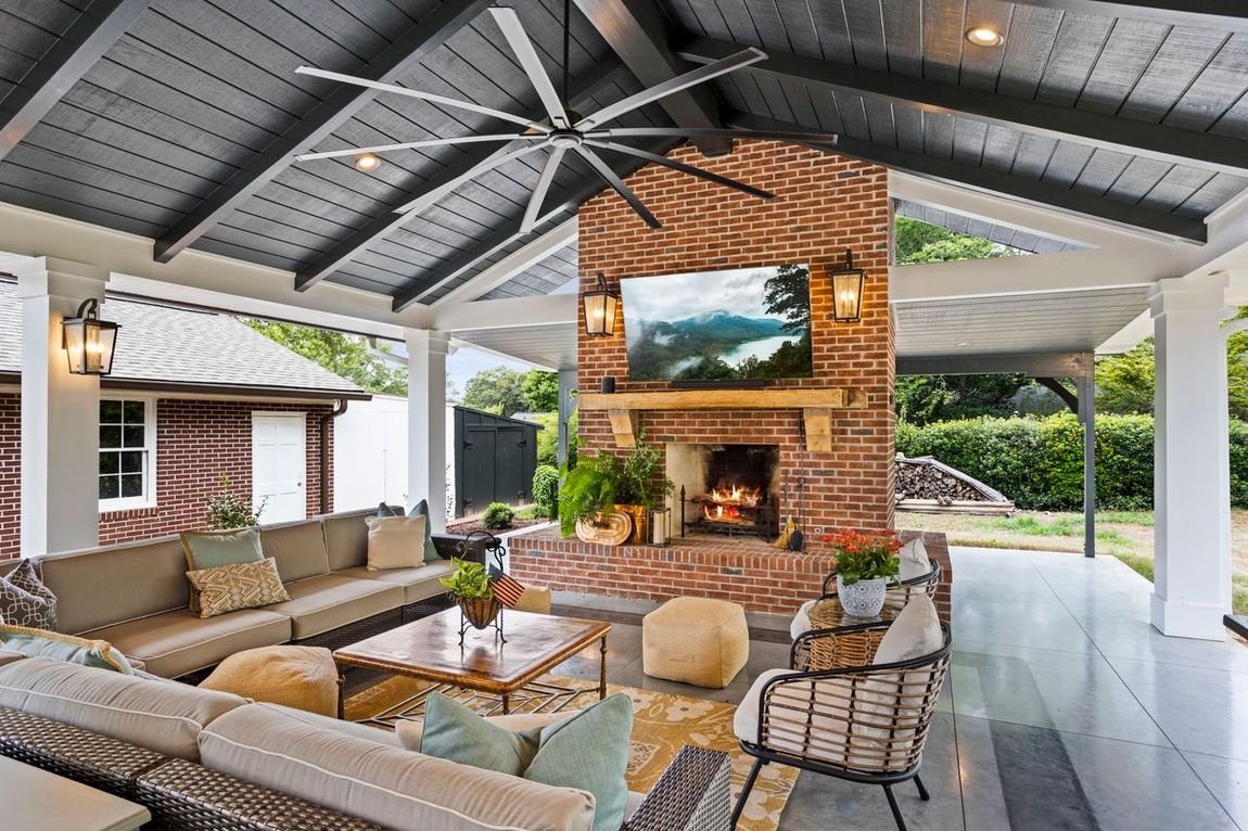Covered patio with fireplace built by Nunley Custom Homes in Greenville, SC.