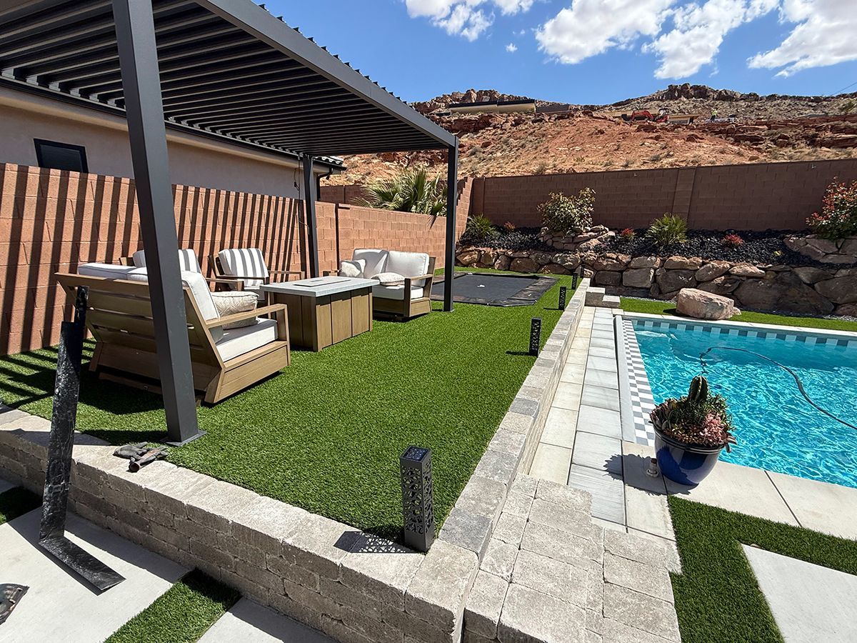 There is a swimming pool in the backyard of a house.