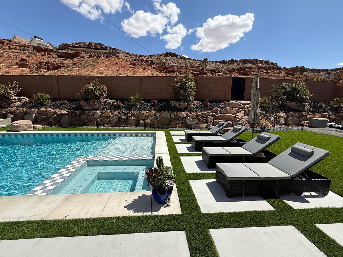 A large swimming pool surrounded by lawn chairs in a backyard.
