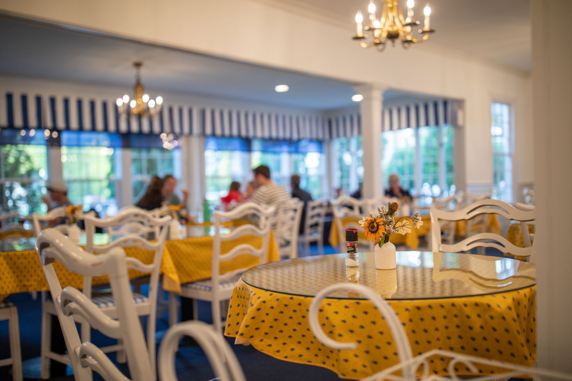 A large white house with a white picket fence in front of it