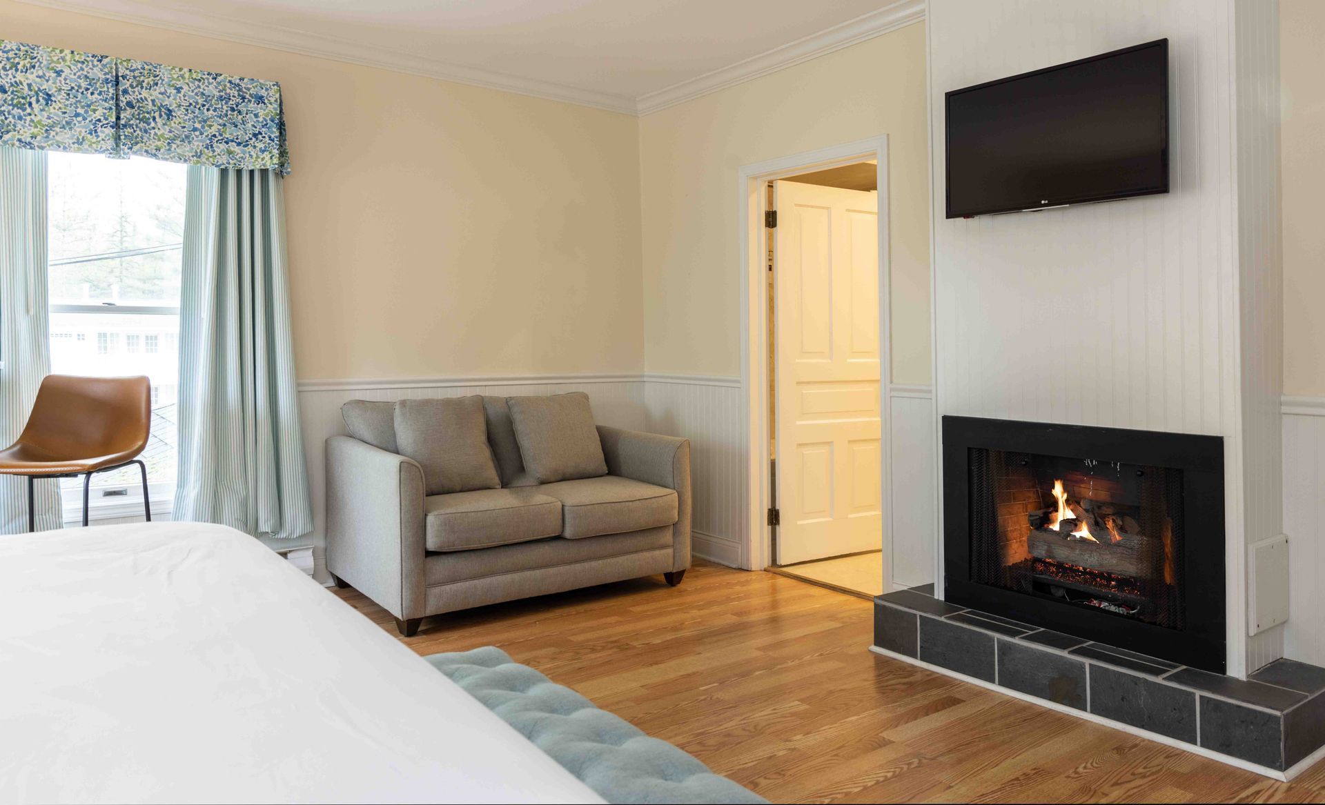 There is a fireplace in the middle of the room.