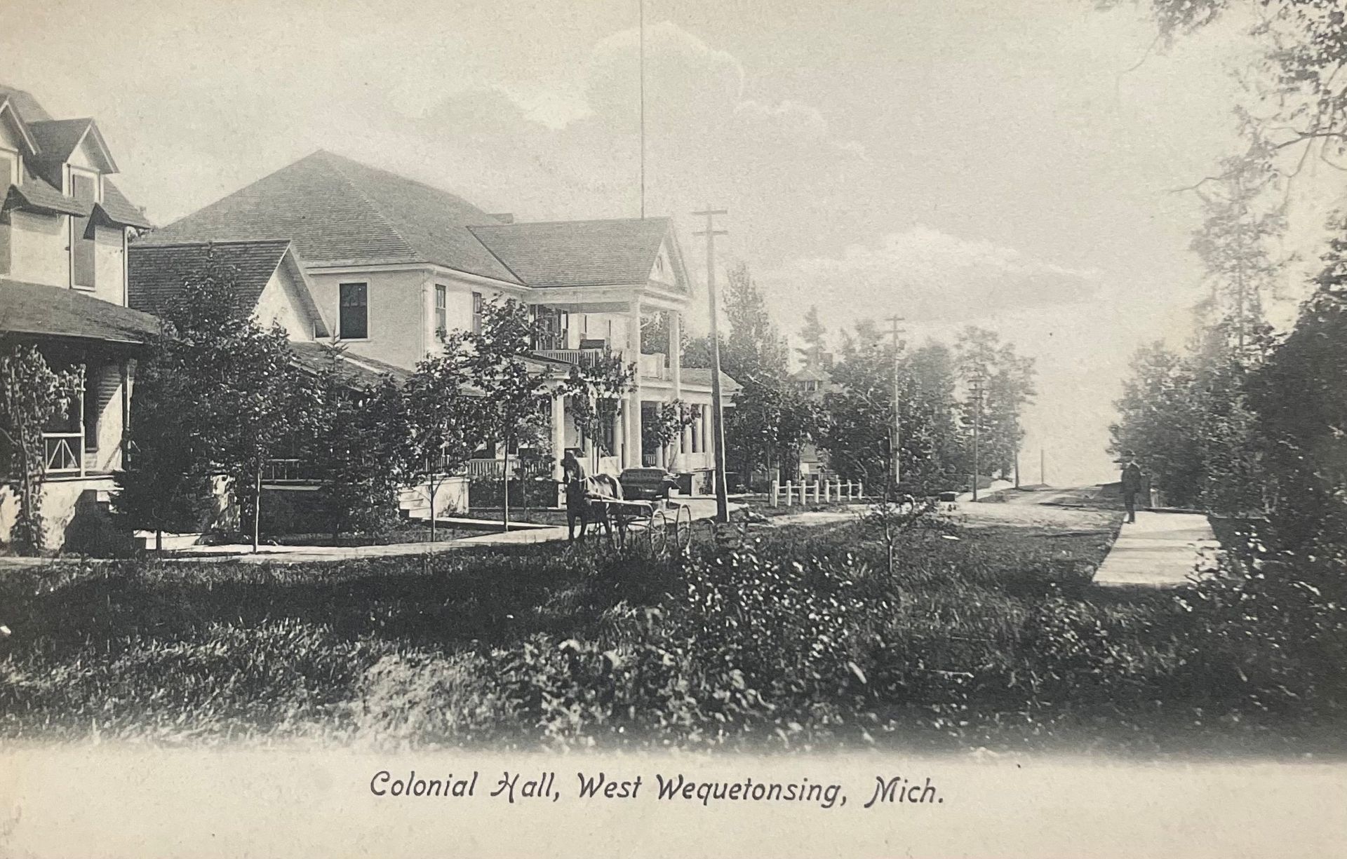 A black and white photo of a coastal hotel